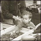 little boy getting a scoop of blue berries, fruit, harvest, farmer's market, holiday, food, family, mother and baby 